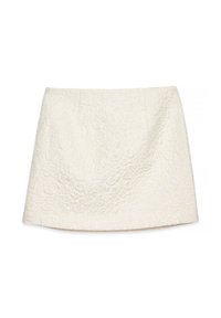 Vit texturerad kjol med blommönster, med en rak silhuett och subtil lyster. Slättyg med dragkedja på sidan.