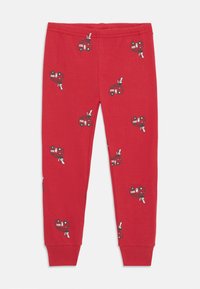 Rote Baumwollleggings mit einem Allover-Druck von Feuerwehrautos und Dalmatinerhunden. Elastischer Bund und enganliegende Bündchen. Weicher Stoff.