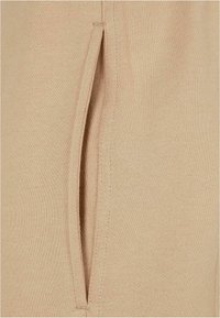 Urban Classics Jogginghose - unionbeige