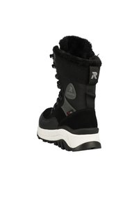 Bottes noires d'extérieur avec un col en fourrure, présentant une épaisse semelle blanche, un laçage à l'avant et des accents en tissu noir texturé.