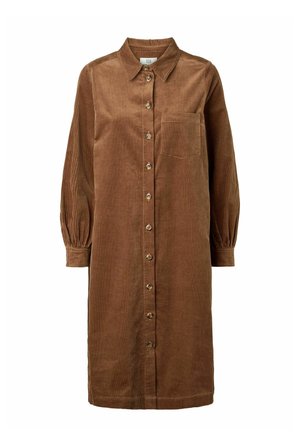 Ruskea corduroy-mekko, jossa on terävä kaulus, pitkät liehukevyiset hihat, edessä napitus ja rintatasku. Pystysuora ribbineulos.
