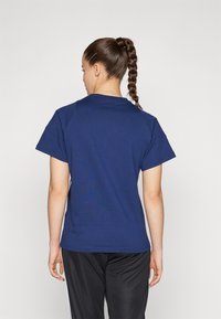 Navy blue short-sleeve t-shirt with a round neckline and a smooth texture. Features a plain design with no visible logos or patterns.