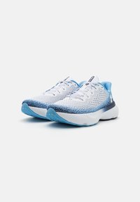 White and blue athletic shoes with a breathable mesh upper, textured pattern, and a cushioned sole for comfort and support.