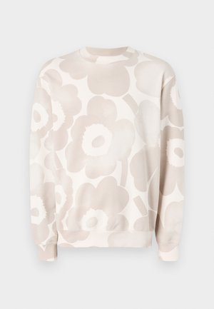 Lys beige sweatshirt med et stort blomstermønster i bløde tan nuancer. Rund halsudskæring og ribbede manchetter med en afslappet pasform.