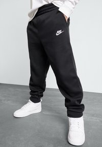 Nike Sportswear - CLUB UNISEX - Tracksuit bottoms - black/white Thumbnail Image 1