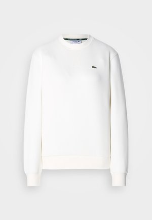 Sweatshirt branco feito de uma mistura de algodão, com decote redondo, punhos canelados e um pequeno logo verde no peito. Textura suave.