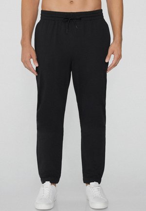 Pantalones deportivos - black