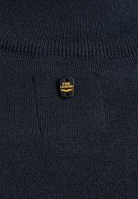 Navy sweater featuring a ribbed texture, rounded neckline, and a small black and gold PME Legend logo tag on the front.