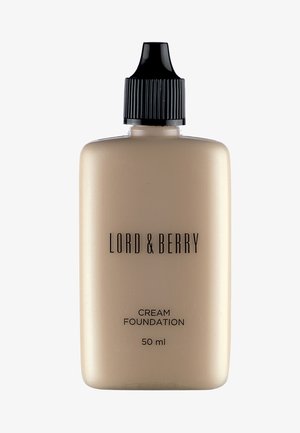 Cremefoundation flaske, 50 ml, med en mat beige beholder, sort skruehætte og fed tekstetiket i sort. Glat tekstur.