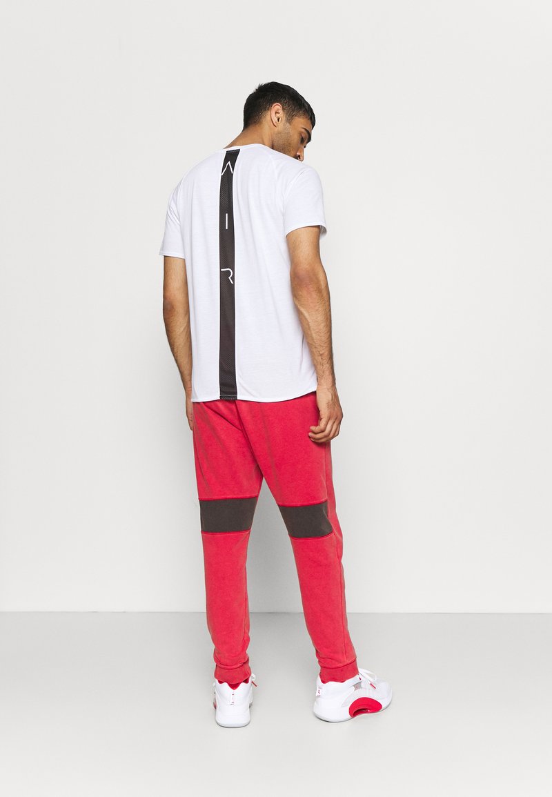 Herren Trainingsanzüge | Jordan AIR PANT Jogginghose gym red/black/rot - SU82508 Herren Trainingsanzüge | Jordan AIR PANT Jogginghose gym red/black/rot - SU82508