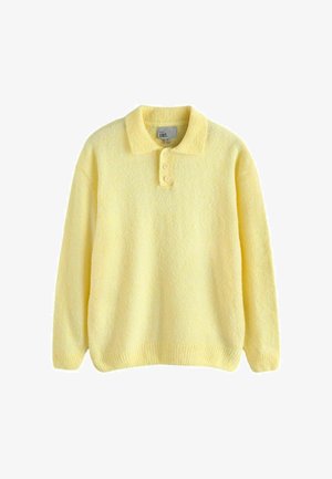 Gul fleece-trøje med klassisk krave, tre-knaps åbning, ribbet kant og blød tekstur. Afslappet og behageligt design.