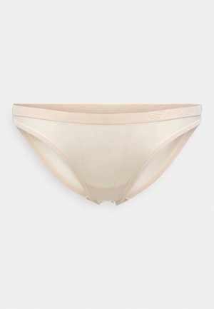 Bikini spodná bielizeň Calvin Klein v svetlo béžovej farbe s hladkým, polopriesvitným materiálom a mäkkým pásom s embosovaným logom. Klasický dizajn.
