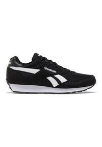 Zapatilla deportiva negra con acentos en blanco, que cuenta con una parte superior de ante y malla, diseño con cordones y suela texturizada para mayor agarre. Logo de Reebok presente.
