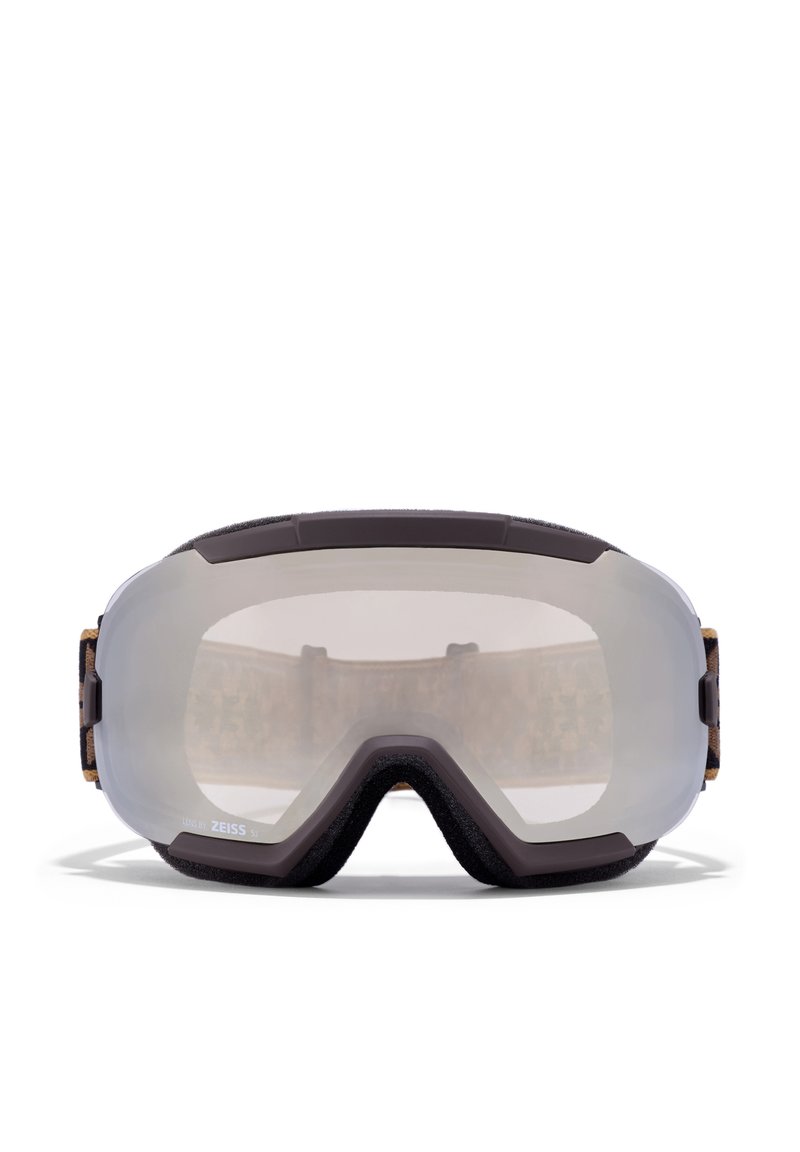 Síszemüveg sötétbarna kerettel, tiszta lencsével és puha habszivacs béléssel. Állítható pánt mintás textil díszítéssel a hátsó részen.