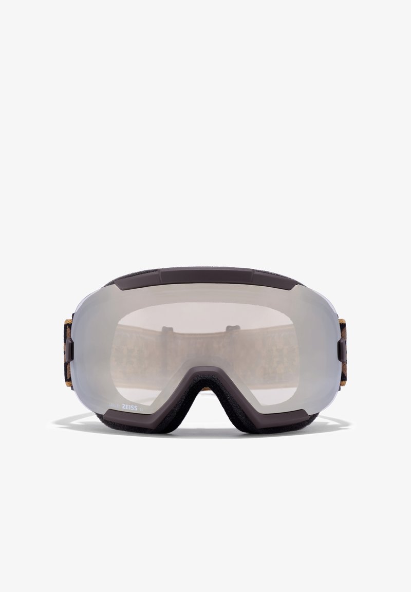 Síszemüveg sötétbarna kerettel, tiszta lencsével és puha habszivacs béléssel. Állítható pánt mintás textil díszítéssel a hátsó részen.