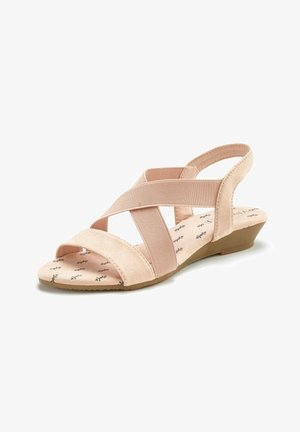 Light pink wedge sandals featuring elastic straps in a crisscross design, soft suede texture, and a cushioned insole with printed detailing.