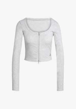 Top gris court à manches longues en tissu côtelé, présentant une fermeture éclair centrale et un col arrondi. Petit logo sur l'ourlet.