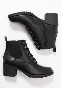 Anna Field Tronchetti - black