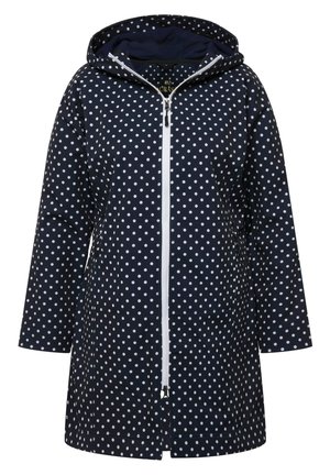 Impermeabile blu con pois bianchi, chiusura con zip, cappuccio e due tasche inferiori. Realizzato in materiale impermeabile con una finitura liscia.