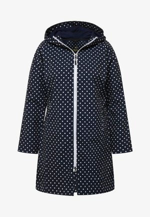 Impermeabile blu con pois bianchi, chiusura con zip, cappuccio e due tasche inferiori. Realizzato in materiale impermeabile con una finitura liscia.