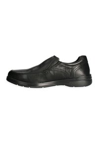Scarpa slip-on nera in pelle con finitura testurizzata, punta rotonda, dettagli cuciti e suola piatta in gomma. Design semplice, senza lacci.