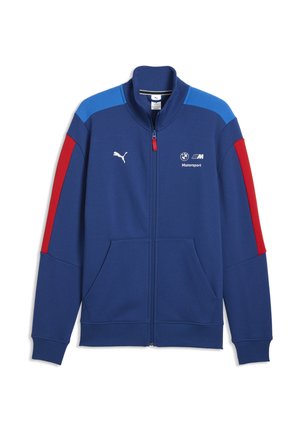 Sininen vetoketjullinen takki, jossa punaiset ja vaaleansiniset raidat hihoissa, Puma- ja BMW Motorsport -logot rinnassa sekä etutaskut.