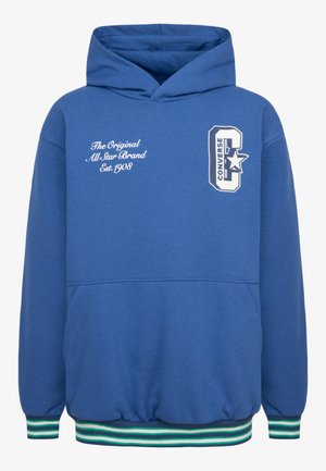 Felpa blu realizzata in morbido tessuto, con tasca frontale, polsini a coste, orlo a righe e logo stampato sul petto e sulla manica.