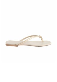 Platt tåsandaler i ljusbeige läder, med två tunna remmar och en mjuk innersula med en minimalistisk design.
