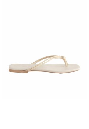 Platt tåsandaler i ljusbeige läder, med två tunna remmar och en mjuk innersula med en minimalistisk design.