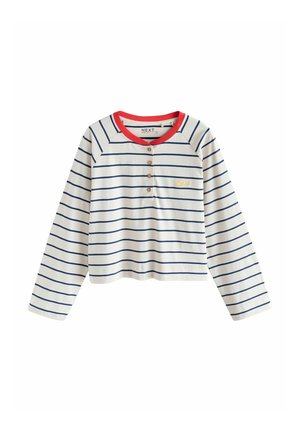 Striped long-sleeve top in cream with navy stripes and a red ribbed collar. Features three wooden buttons and gold embroidered detail.
