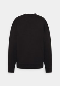 Schwarzes Sweatshirt mit Rundhalsausschnitt, überschnittenen Schultern und gerippten Bündchen. Der Stoff wirkt strukturiert und weich, mit einem schlichten, einfarbigen Design.