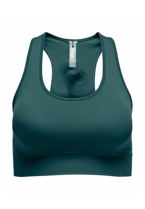 Dark teal seamless sports bra with racerback design and elastic band at the bottom, shown from the front with visible size tag.