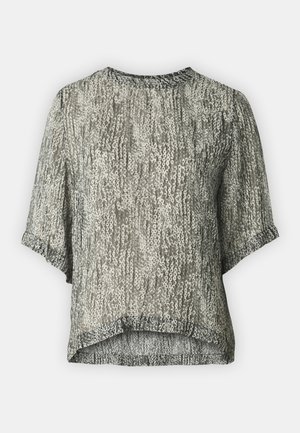 Haut à manches courtes en tissu transparent avec un motif en sequins gris et crème. Encolure ronde et ourlet légèrement incurvé. Légèrement texturé et léger.