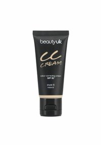 Mustaputkilo CC-voidetta, jossa on käännettävä korkki, merkitty "beautyuk", kultakirjaimilla; SPF 30, sävy 10, luonnollinen väri, sileä rakenne.