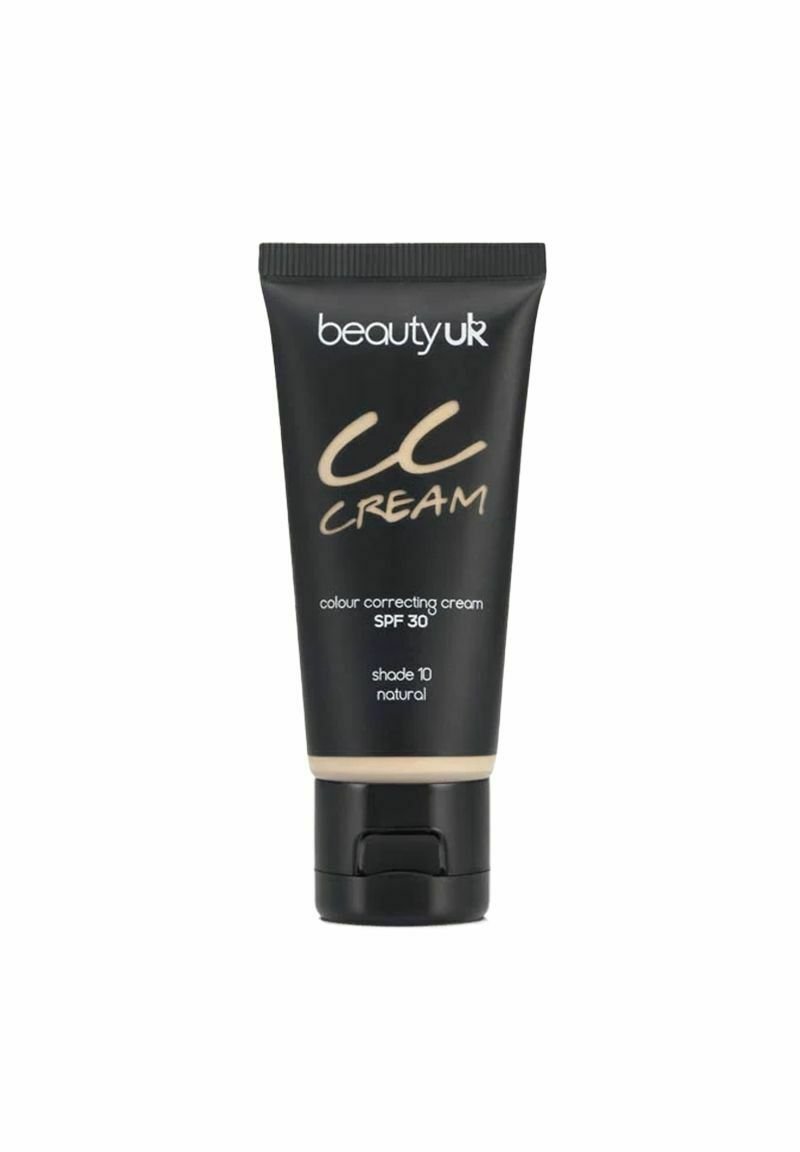 Mustaputkilo CC-voidetta, jossa on käännettävä korkki, merkitty "beautyuk", kultakirjaimilla; SPF 30, sävy 10, luonnollinen väri, sileä rakenne.