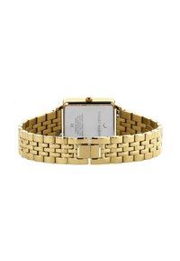 Gouden metalen horloge met een rechthoekige wijzerplaat, schakelarmband en een sluiting. Achterkant bevat merk- en vervaardigingsinformatie.