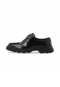 Schwarze Lederhalbschuhe mit glatter Oberfläche, runder Spitze und einer dicken, strukturierten Gummisohle. Mit dezentem Schnürdetail.