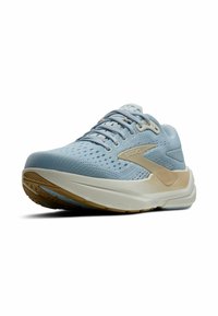 Heledad sinine jooksujalanõud hingava pealmise osaga, beežide aksessuaari, pehmendatud tallaga ja tekstuurse kummist välistallaga haardeks.