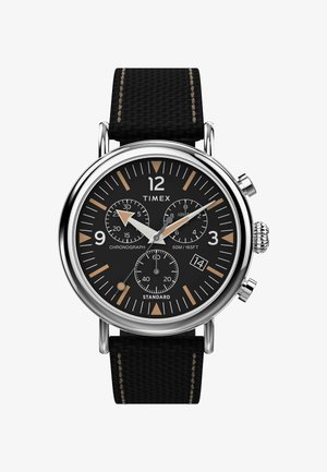 Timex chronograph watch with a black dial, silver-tone stainless steel case, black fabric strap, and gold accents on hour markers.