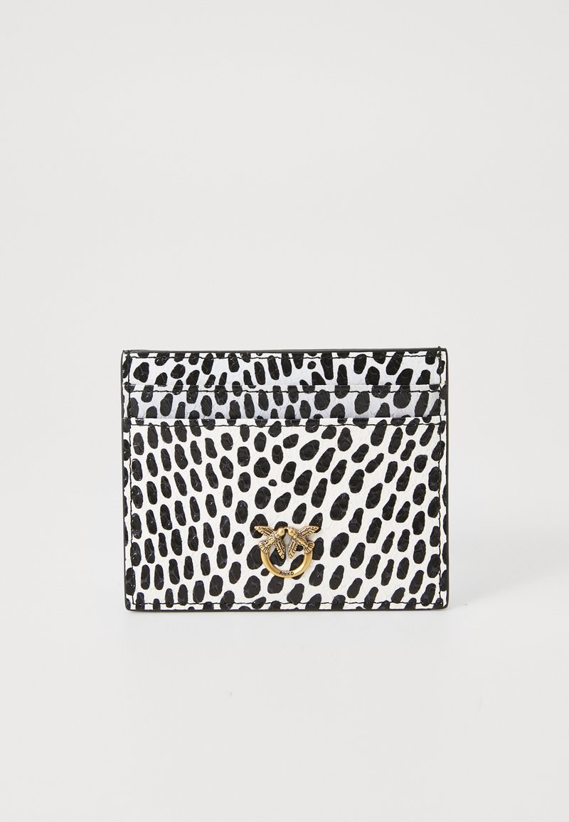 Κάρτα σε ασπρόμαυρο, με μοτίβο κουκίδων, λεία επιφάνεια και χρυσό έμβλημα μέλισσας. Συμπαγές ορθογώνιο σχήμα με θήκες.