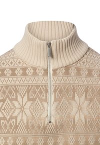 Beige zip-up sweater with ribbed collar, featuring a knit pattern of snowflakes and geometric shapes in lighter and darker shades of beige.