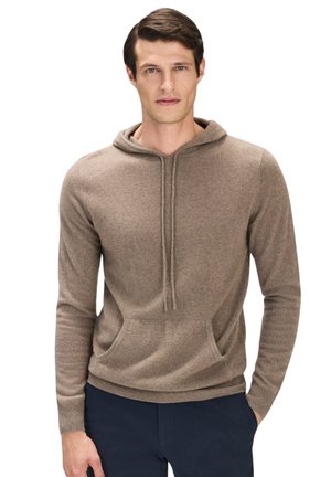 Brun hoodie i mjukt material, med känguruficka, snörning och långa ärmar med ribbade muddar.