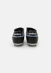 Black football boots with a textured leather finish, featuring blue accents and a prominent white logo on the heel. Includes metal studs.