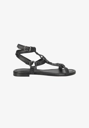 Black leather sandal featuring a stylish strap design, buckle closure, flat sole, and cut-out detailing on the sides.
