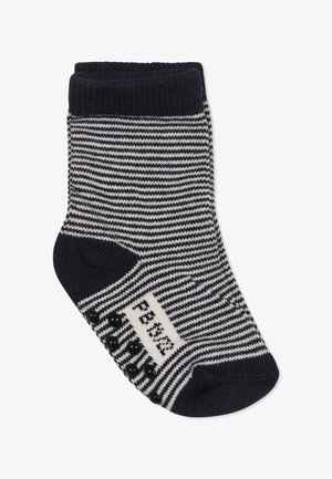 Calzino a righe blu navy e bianche con polsino a coste, punta arrotondata e grip in gomma nera sulla suola per una migliore trazione. Materiale in misto cotone.