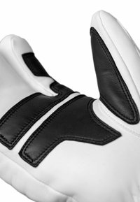 Weißer Lederhandschuh mit schwarzen Akzenten, ausgestattet mit gestickten Mustern und strukturierten Einsätzen. Das Daumendesign sorgt für Flexibilität und Grip.