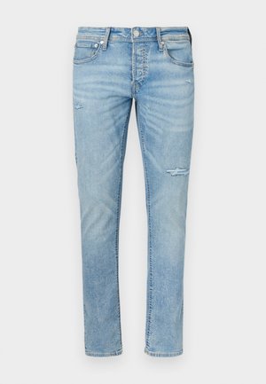 Lichtblauwe spijkerbroek met een slim fit, lichte slijtage met kleine scheurtjes, vijfzakkenontwerp en standaard knoopsluiting.