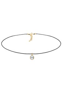 Collana con filo nero e un singolo pendente rotondo in cristallo trasparente, con una montatura in metallo color oro e un gancio della catena dorato.