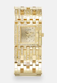 Gouden polshorloge met een vierkant uurwerk, versierd met kristallen. Beschikt over een gestructureerde band met rechthoekige schakels en glanzende accenten.