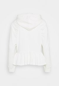 Felpa bianca con orlo a peplo, maniche arricciate e cappuccio con cordino. Realizzata in un tessuto morbido, presenta una texture liscia.